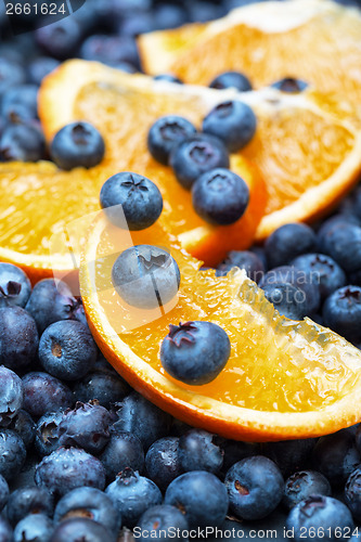Image of Freshly picked blueberries with orange