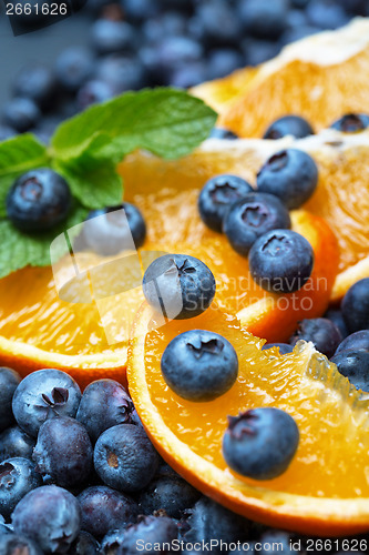 Image of Freshly picked blueberries with orange