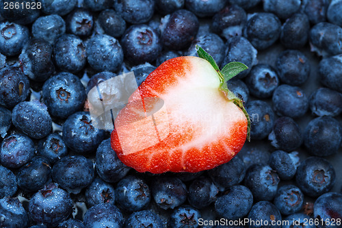 Image of Freshly picked blueberries with strawberry