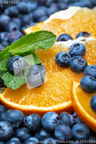 Image of Freshly picked blueberries with orange