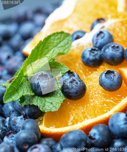 Image of Freshly picked blueberries with orange