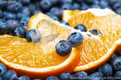 Image of Freshly picked blueberries with orange