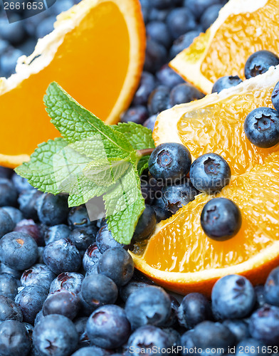 Image of Freshly picked blueberries with orange