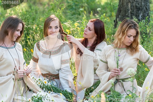 Image of Beautiful women relaxing on nature