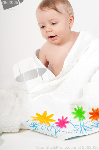 Image of Baby boy in white floral towel