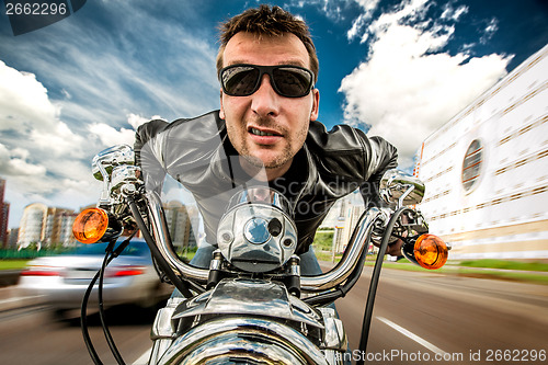 Image of Funny Biker racing on the road