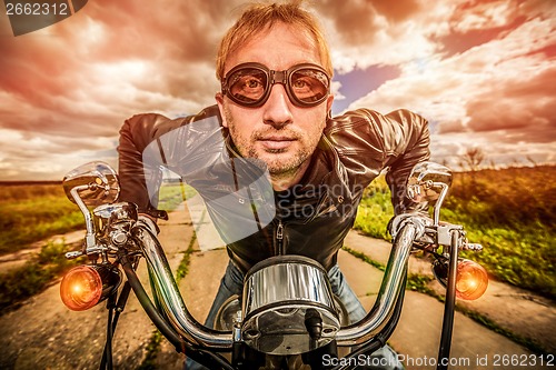 Image of Funny Biker racing on the road