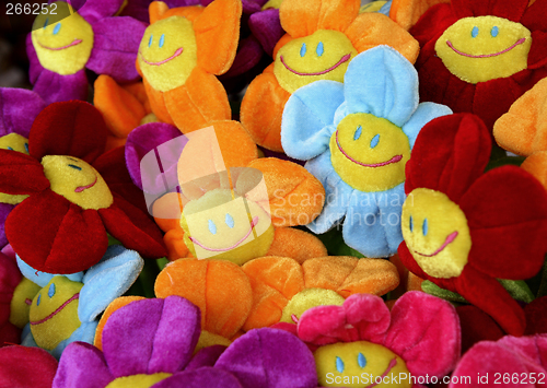 Image of smiling colourful fabric flowers