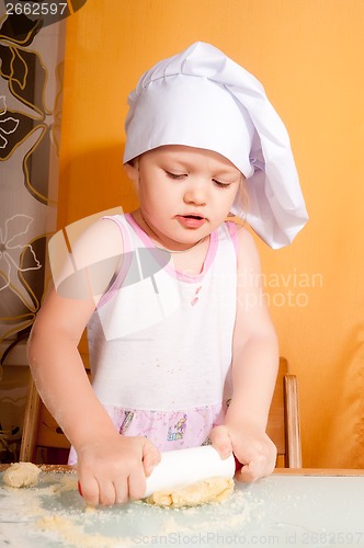 Image of baby girl in cook role