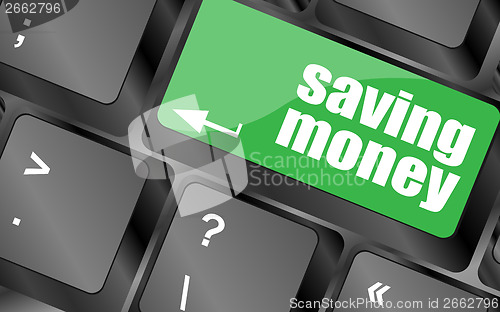 Image of saving money for investment with a button on computer keyboard