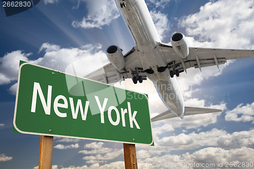 Image of New York Green Road Sign and Airplane Above