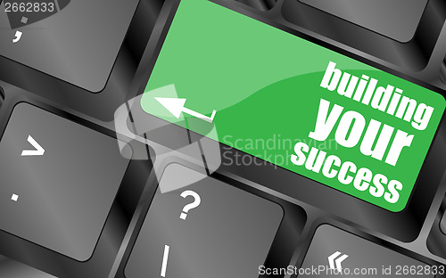 Image of building your success words on button or key showing motivation for job or business