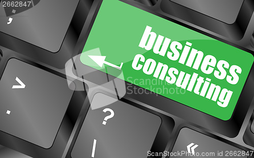 Image of Computer keyboard with business consulting key. business concept