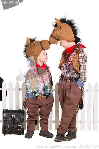 Image of Two boys wearing horse costumes