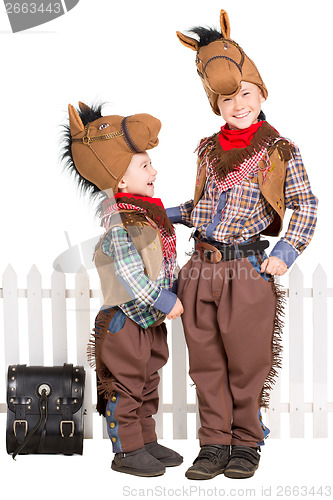 Image of Two boys wearing horse costumes