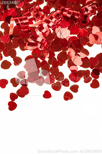 Image of Red hearts confetti on white background