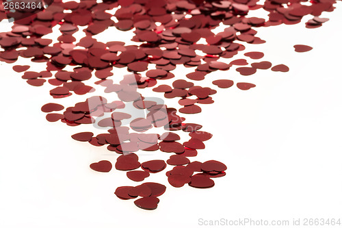 Image of Red hearts confetti on white background