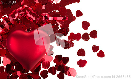 Image of small red confetti and big hearts on white background