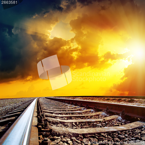 Image of cloudy sunset over railroad