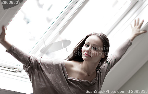 Image of Young woman at a window 