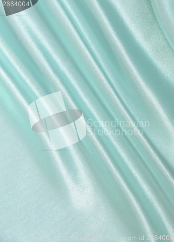 Image of Smooth elegant blue silk as background 