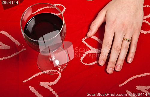 Image of Scandinavian cute young girl hands shaping a heart and wine glas