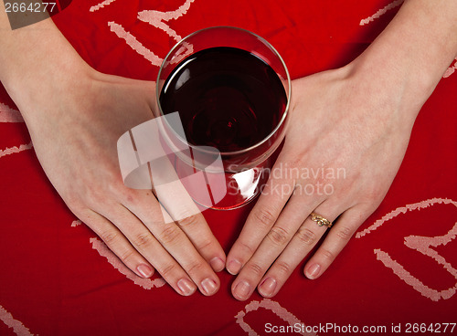 Image of Scandinavian cute young girl hands shaping a heart and wine glas