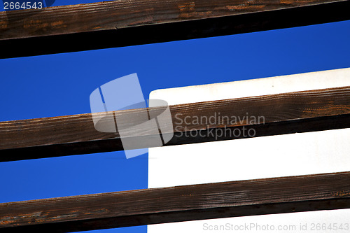 Image of piece of brown   wood as a roof in the sky  lanzarote