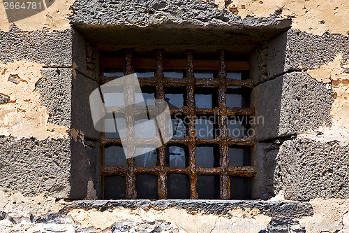 Image of brown distorted  castle window   broke   wall arrecife lanzarote