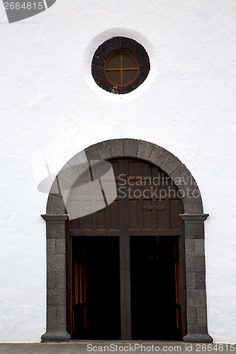 Image of  lanzarote  spain canarias     closed wood  church door and whit