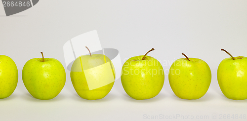 Image of apples in a row