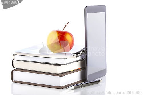 Image of Tablet pc with school and office supplies