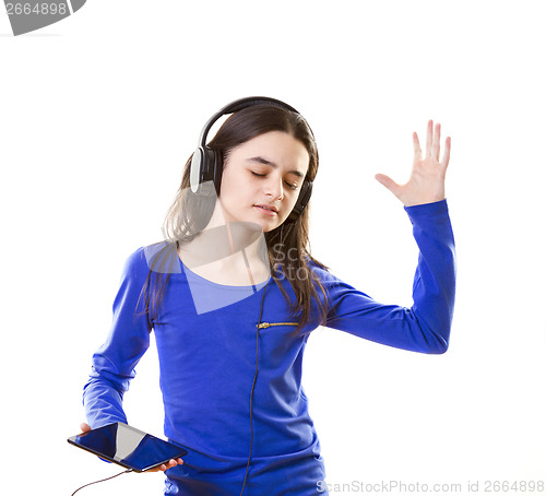 Image of Smiling girl listening to music