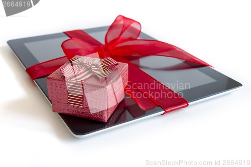 Image of Digital tablet with christmas present