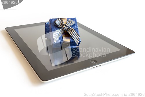 Image of Digital tablet with christmas present