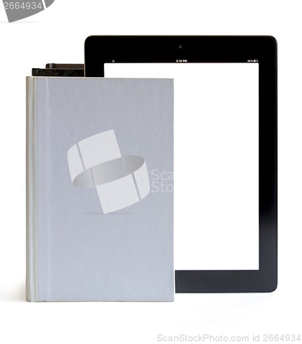 Image of Tablet pc into the books