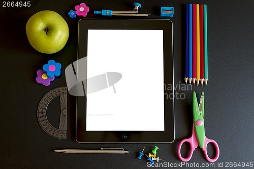 Image of Digital tablet with school accesories