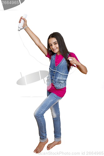 Image of teenage girl playing video games 