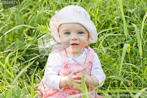 Image of Happy baby girl with blue eyes 