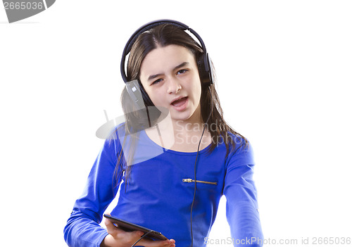 Image of Smiling girl listening to music