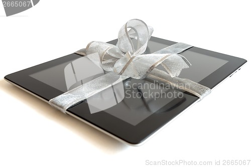 Image of Digital tablet with christmas present