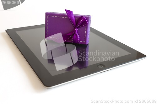 Image of Digital tablet with christmas present