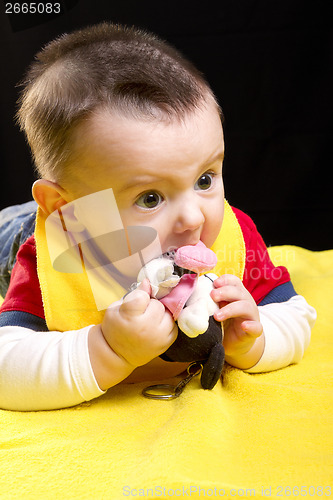 Image of Baby boy with toy 