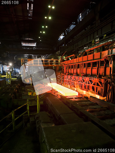 Image of Hot steel on conveyor