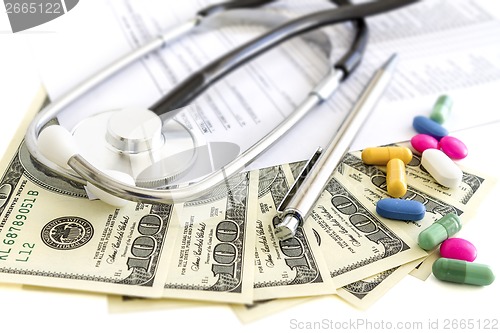 Image of Money, stethoscope and pills, medical insurance