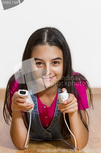 Image of teenage girl playing video games 