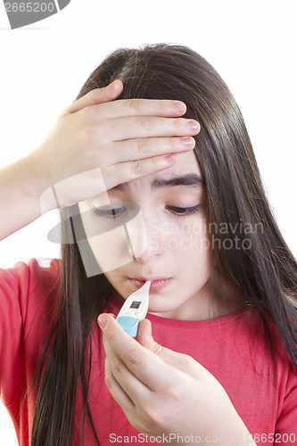 Image of ill girl child with thermometer