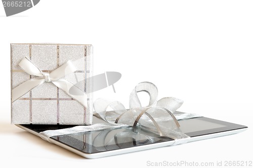 Image of Digital tablet with christmas present