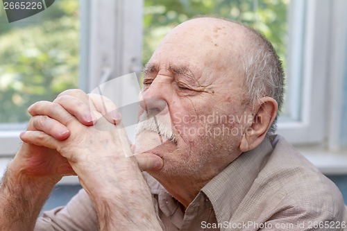 Image of senior man thinking