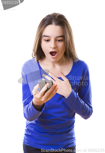 Image of Surprised teenage girl with smartphone